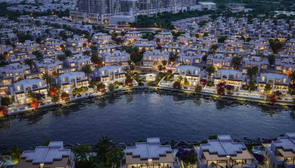 Night view of waterfront residential villas with illuminated windows