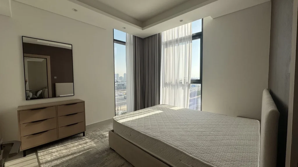 Bedroom with window view in Cloud Towers apartment Jumeirah Village Triangle Dubai