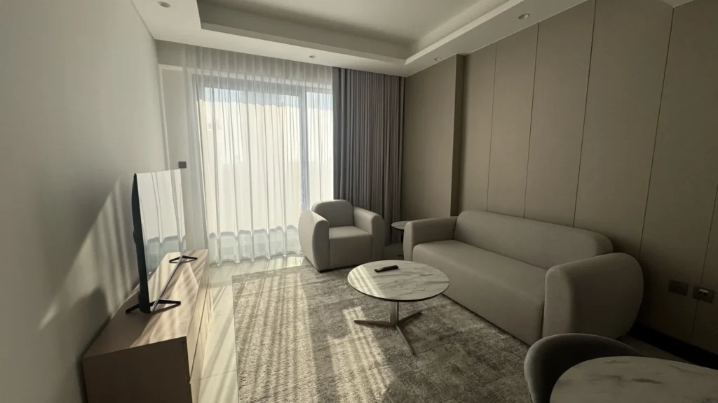 Гостиная с диваном и креслом в апартаментах Cloud Towers Jumeirah Village Triangle Dubai, вид 2 из 2