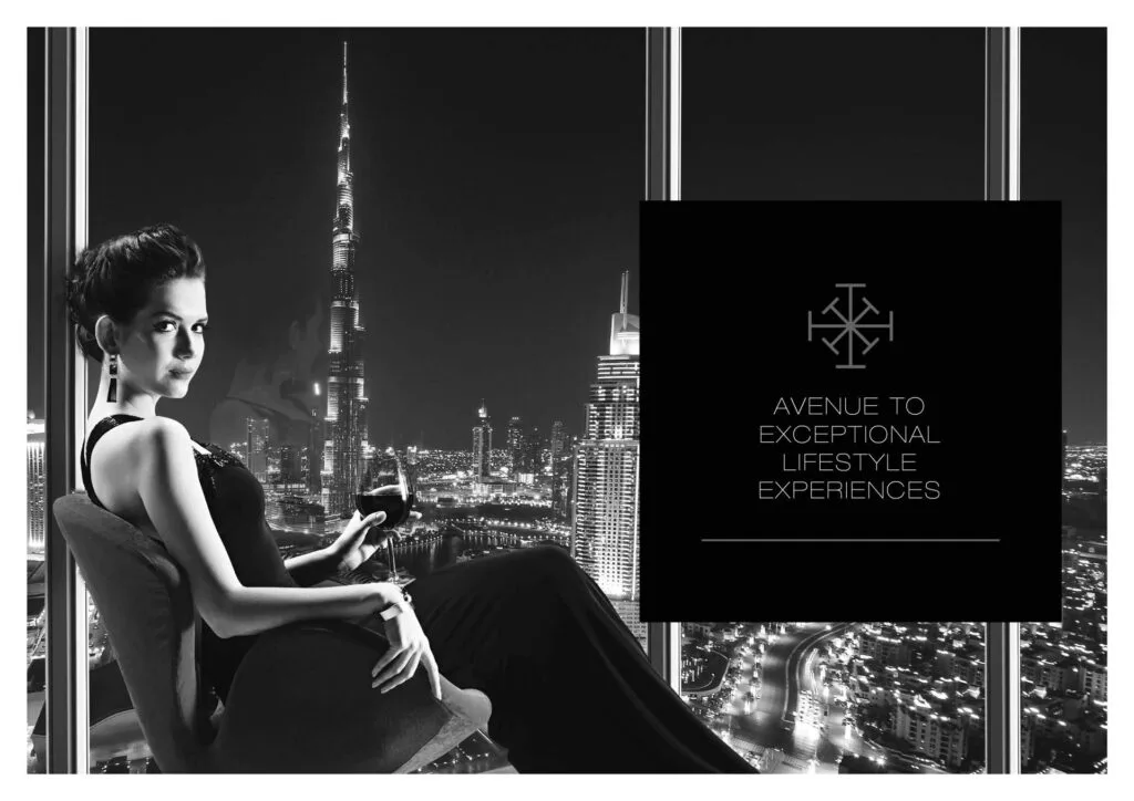 Woman sitting indoors with night city skyline view