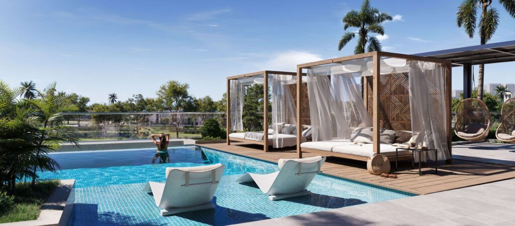 Outdoor pool area with lounge chairs and cabanas