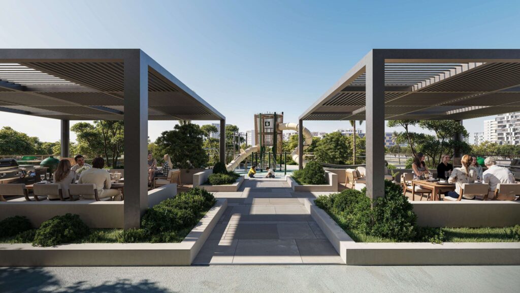 Outdoor seating area with pergolas and playground in background