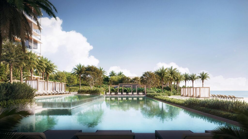 Outdoor swimming pool with palm trees and lounge chairs