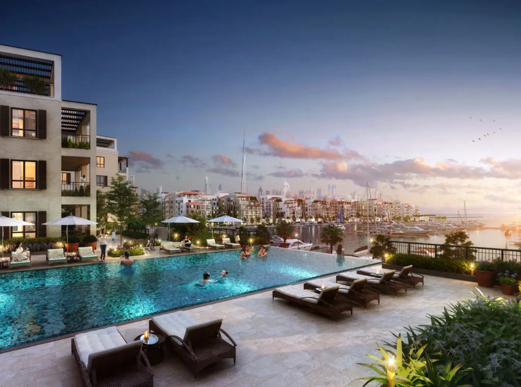 Rooftop swimming pool terrace with sun loungers overlooking the marina at dusk, La Rive (developer rendering)