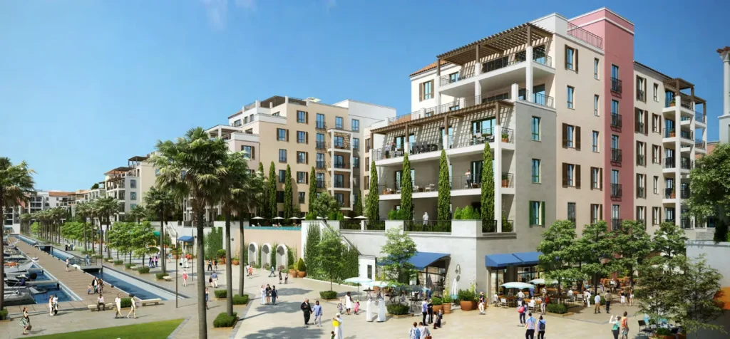 Landscaped waterfront walkway beside colourful La Rive apartment buildings (developer rendering)