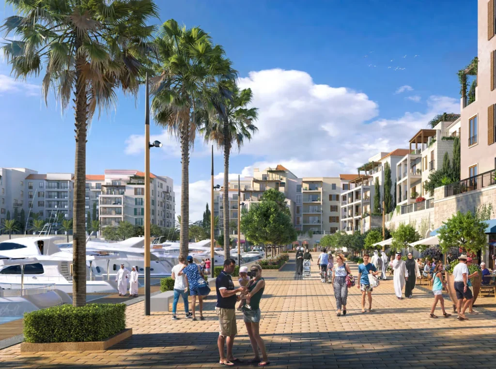 Palm-lined marina promenade with yachts and pedestrians at La Rive (developer rendering)