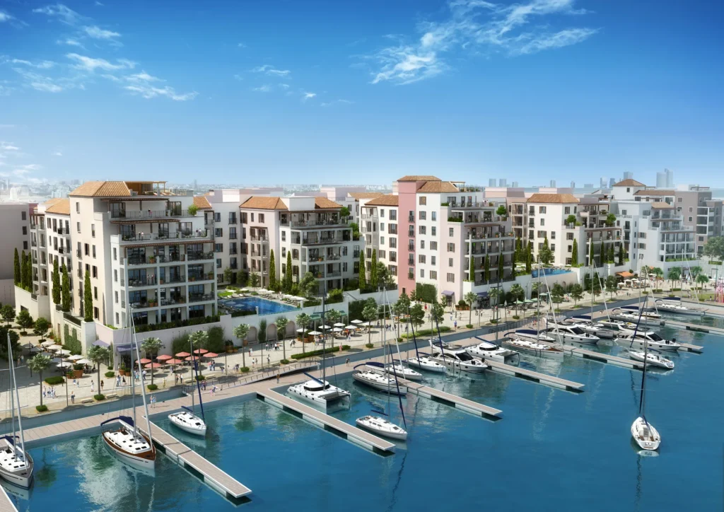 La Rive by Meraas in Port de La Mer, Dubai — Waterfront residential buildings surrounding a marina with boats