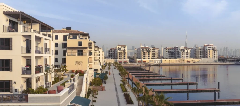 Marina promenade and floating docks beside La Rive residential buildings at Port de La Mer (developer rendering)