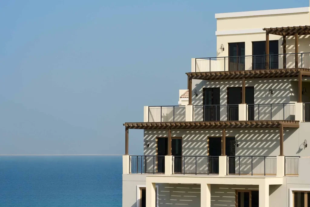 Upper floors of a Port de La Mer apartment building with terraces and pergolas by the sea (developer rendering)