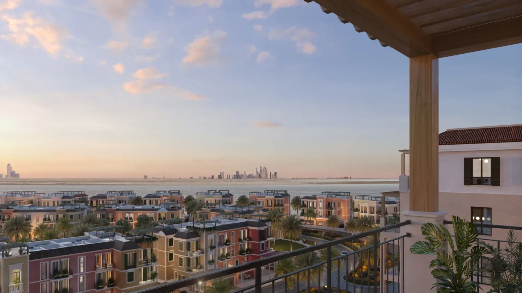 View from a La Sirene apartment balcony toward the sea and Dubai skyline at sunset (developer rendering)