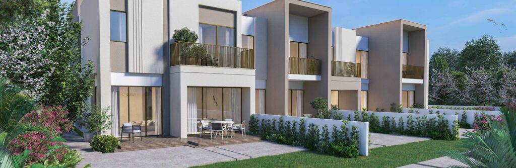 Exterior view of modern townhouses with balconies and garden