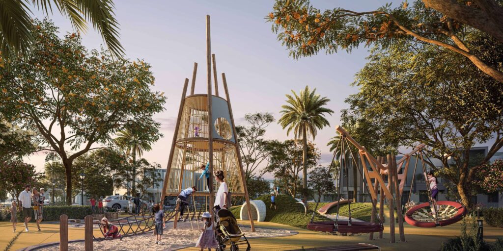 Outdoor playground with climbing structure and swings surrounded by trees
