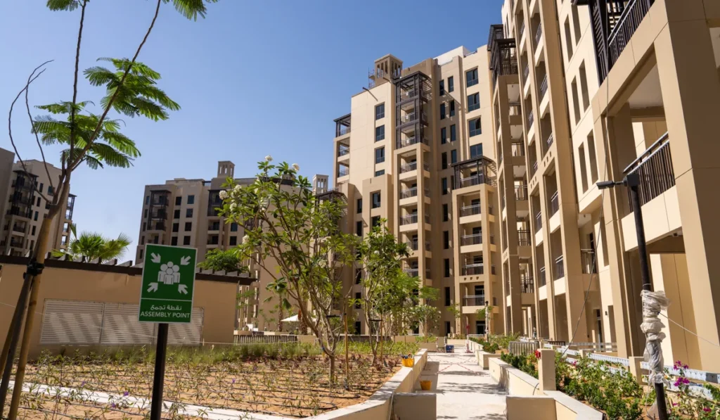 Lamaa Mjl by Meraas in Madinat Jumeirah Living, Dubai — Apartment buildings surround landscaped pedestrian courtyard and pathways