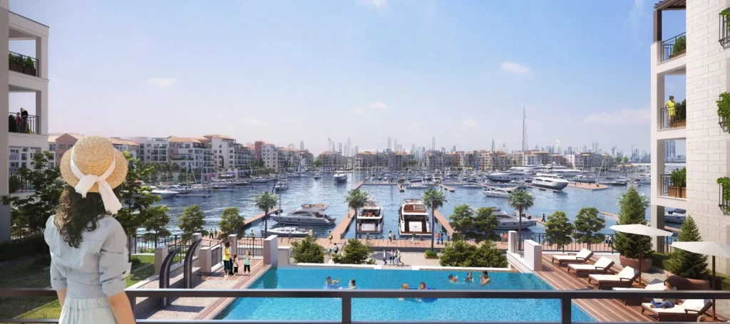 View from the Le Pont pool terrace over the marina toward waterfront buildings (developer rendering)