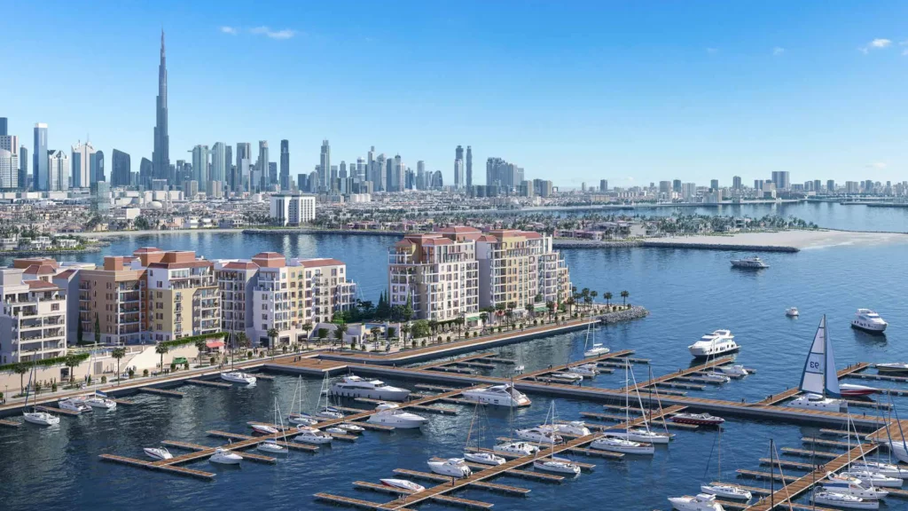 Aerial view of the Port de La Mer marina and waterfront buildings with Burj Khalifa on the skyline (developer rendering)