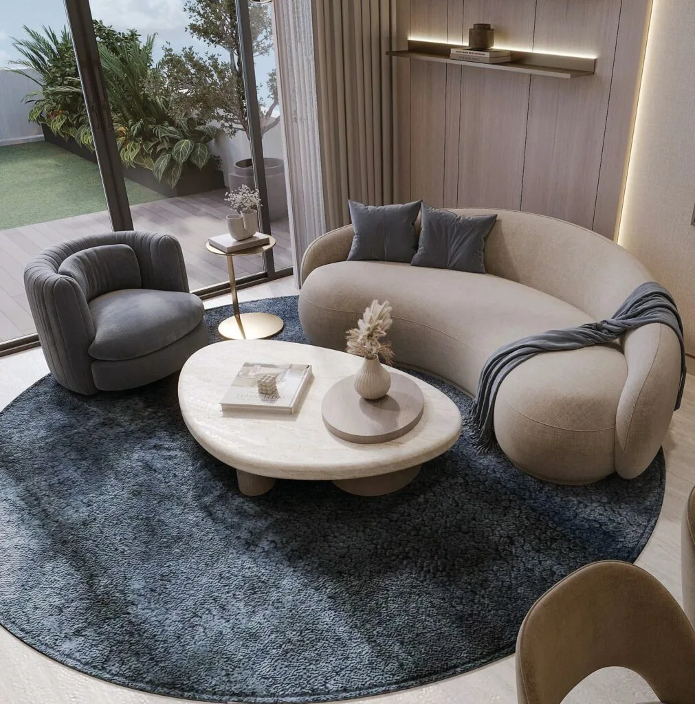 Interior living room with curved sofa and round rug