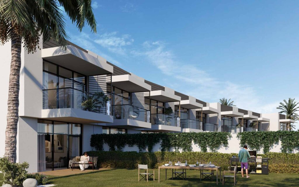 Modern row of residential buildings with garden and outdoor dining