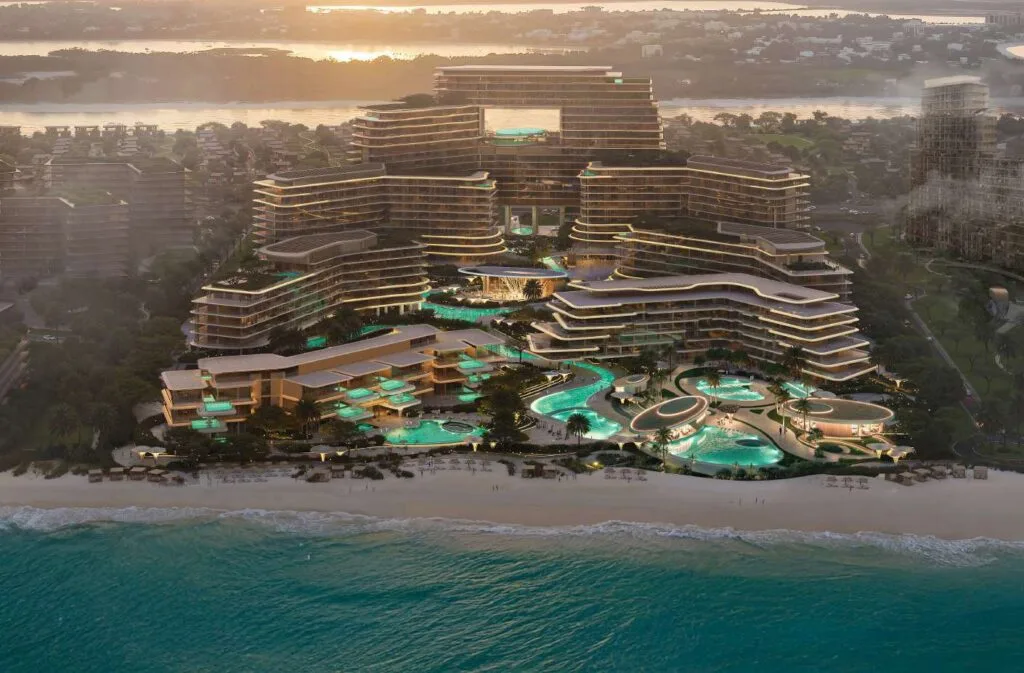 Aerial view of tiered beachfront residential building at sunset