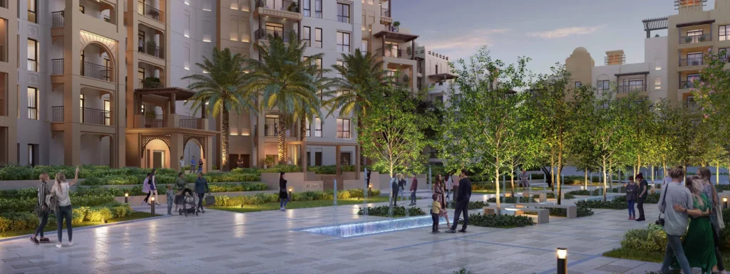 Evening courtyard plaza between Al Jazi buildings with trees and walking paths (developer rendering)