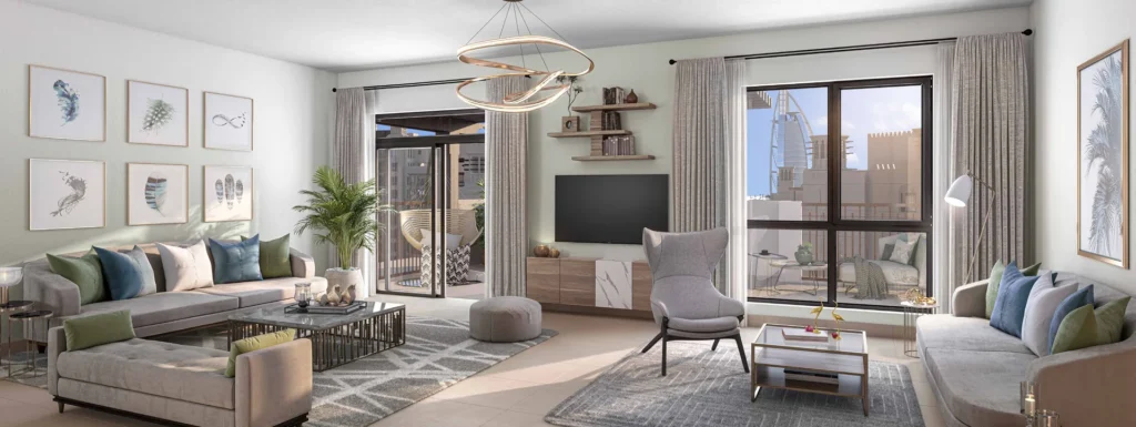 Al Jazi apartment living room with sofas and large windows (developer rendering)