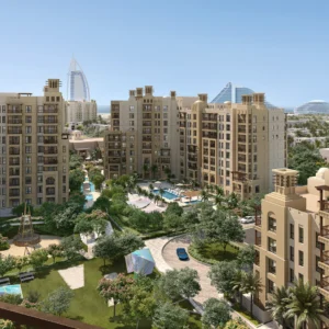 Al Jazi building exterior at Madinat Jumeirah Living with terraces and landscaped grounds (developer rendering)