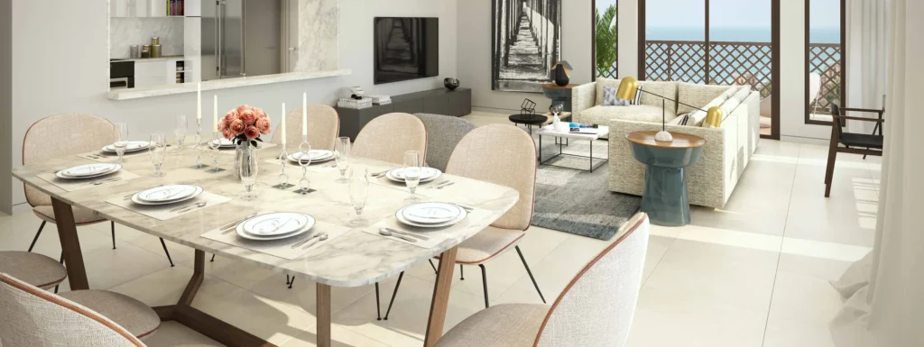 Lamtara apartment dining table and lounge with sea-view windows (developer rendering)