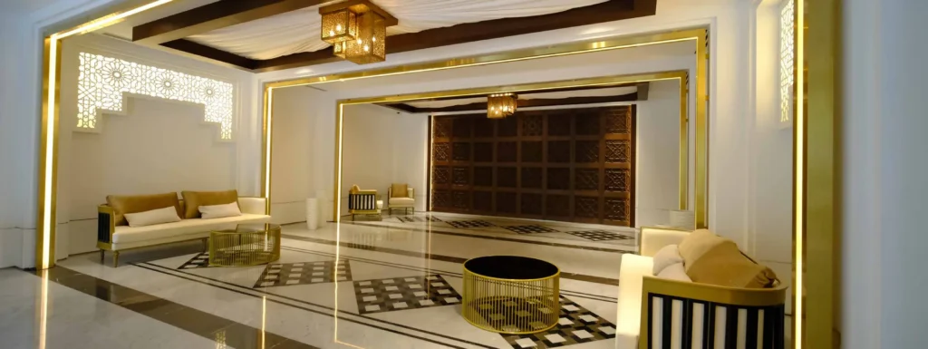 Lamtara residential lobby with marble floor and gold-framed wall features (developer rendering)