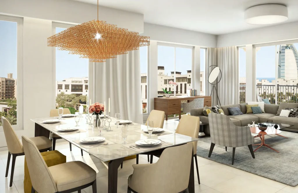 Rahaal apartment living and dining area with pendant light and sea-view windows (developer rendering)