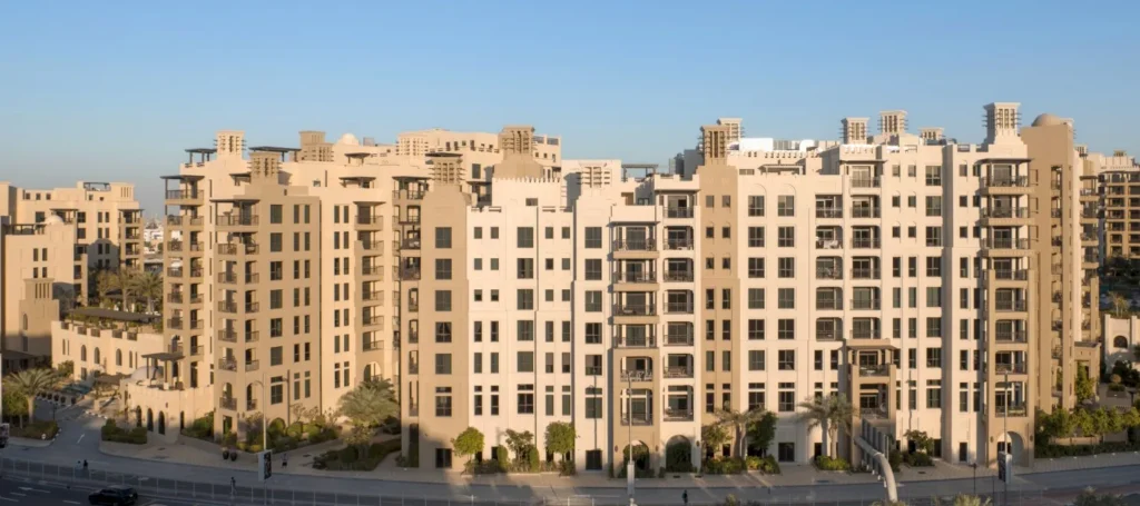 Rahaal apartment buildings with sand-coloured facades and balconies (developer rendering)