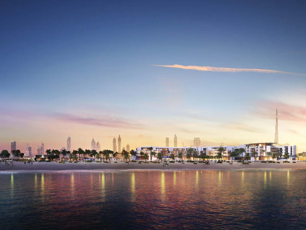 Pearl Jumeira waterfront with Nikki Beach Residences and Dubai skyline at dusk (developer rendering)