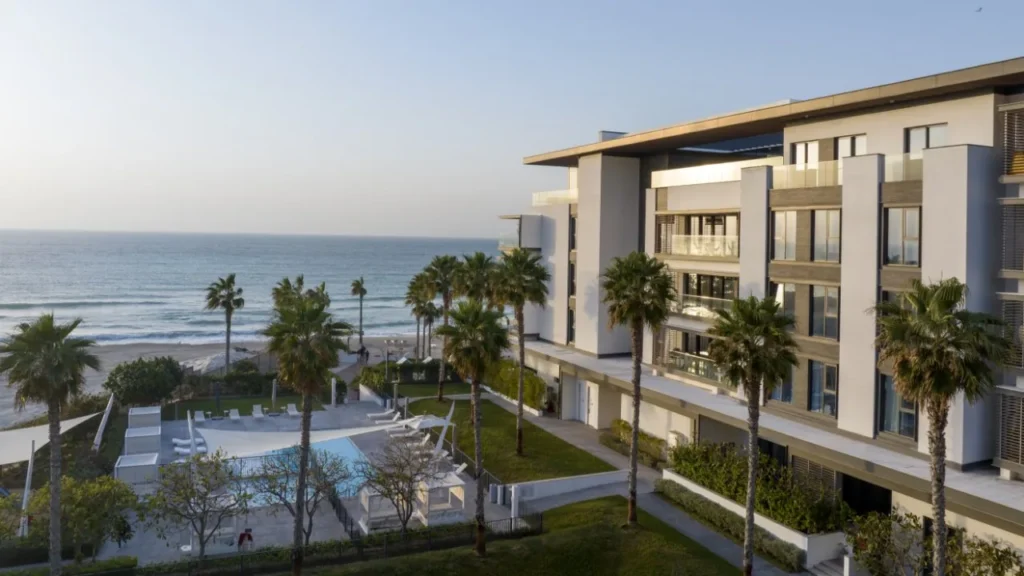 Nikki Beach Residences Dubai building and pool terrace beside the sea on Pearl Jumeira