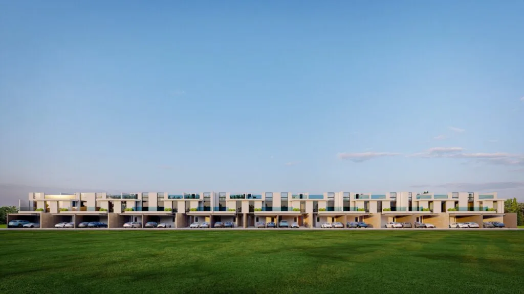 Exterior view of modern townhouses with cars parked
