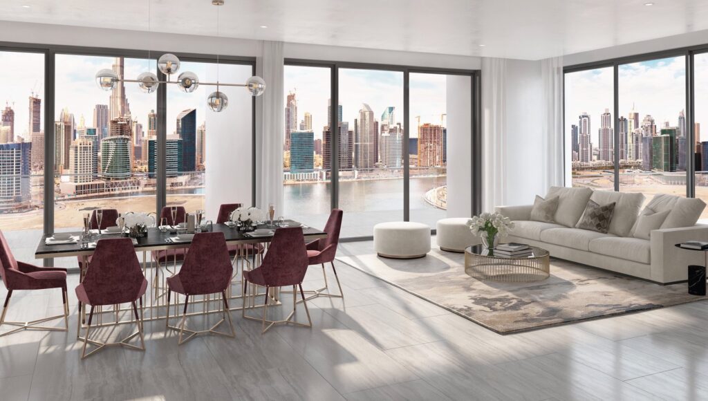 Interior dining and living area with large windows overlooking city skyline