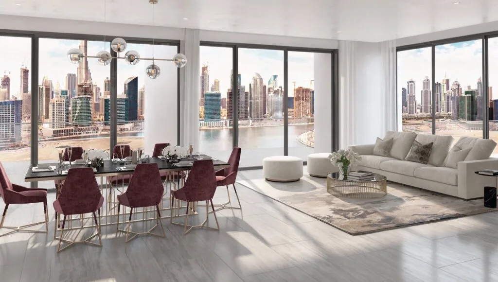 Interior dining and living area with large windows overlooking city skyline