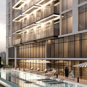Exterior view of building with pool and sun loungers