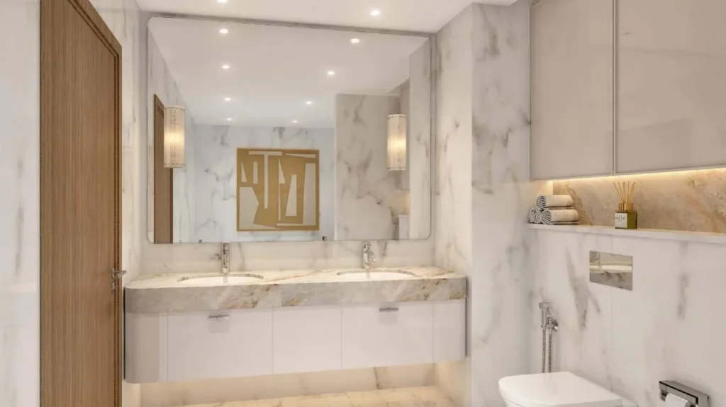 Санузел с двойной раковиной и зеркалом в апартаментах Azizi Venice 7 Dubai South