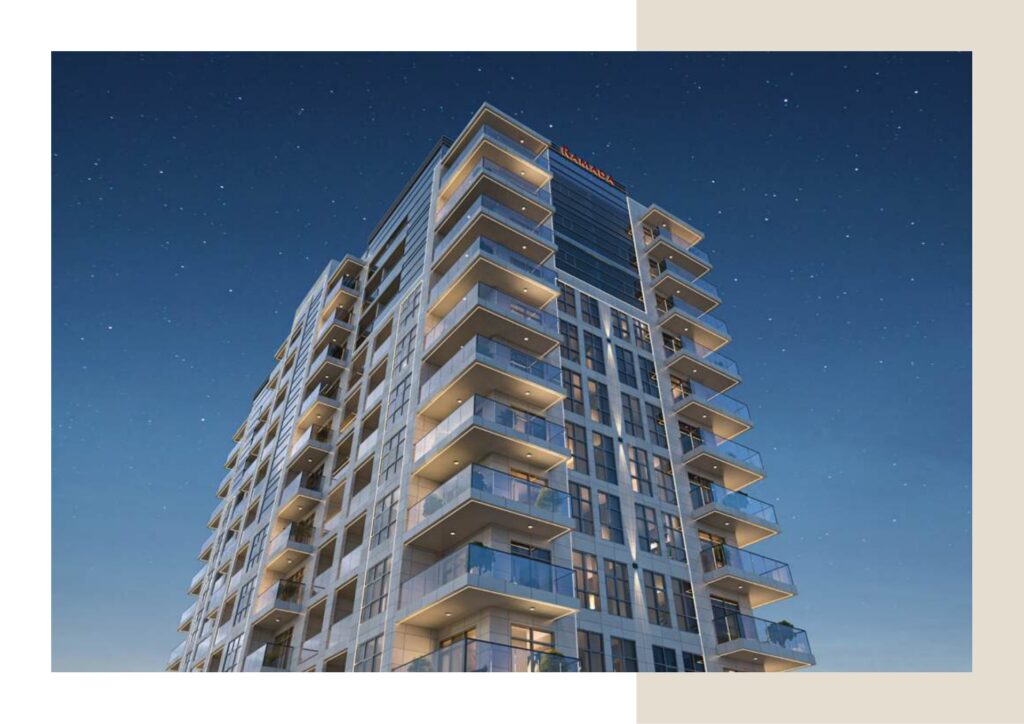 Exterior night view of a multi-story residential building with balconies