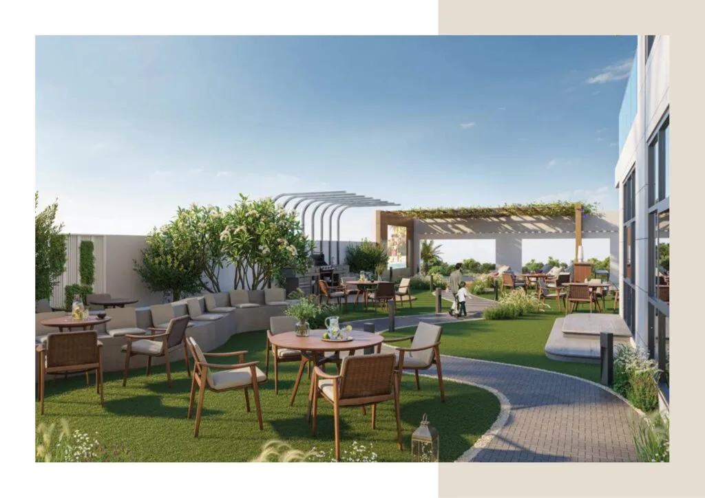 Outdoor seating area with tables, chairs, and pergola on rooftop