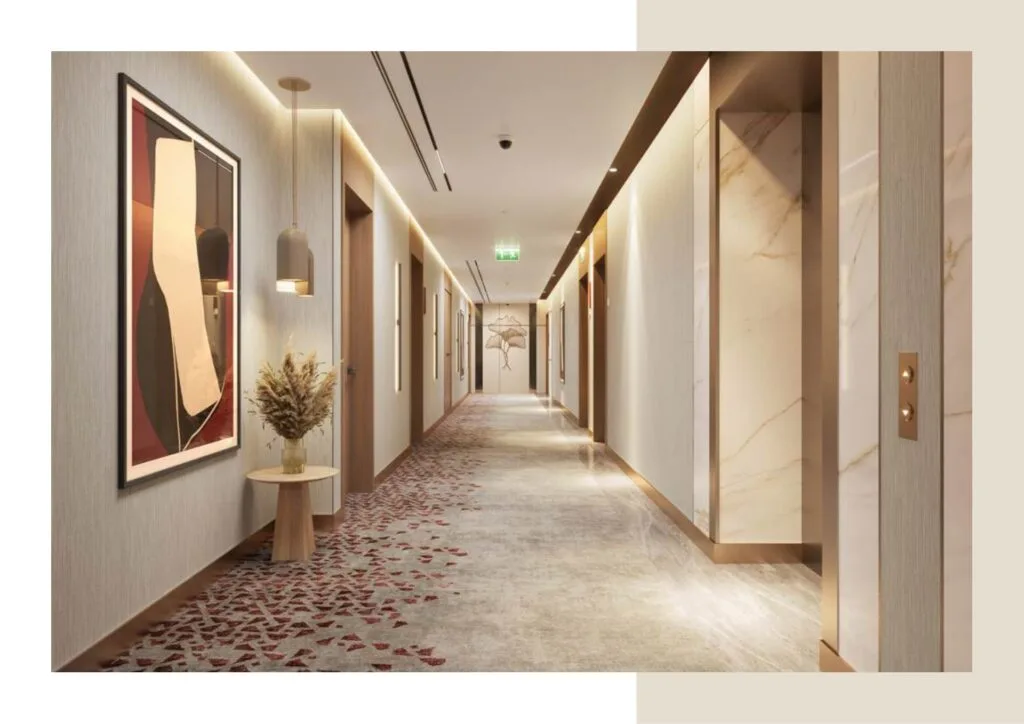 Interior corridor with artwork, lighting, and elevator doors