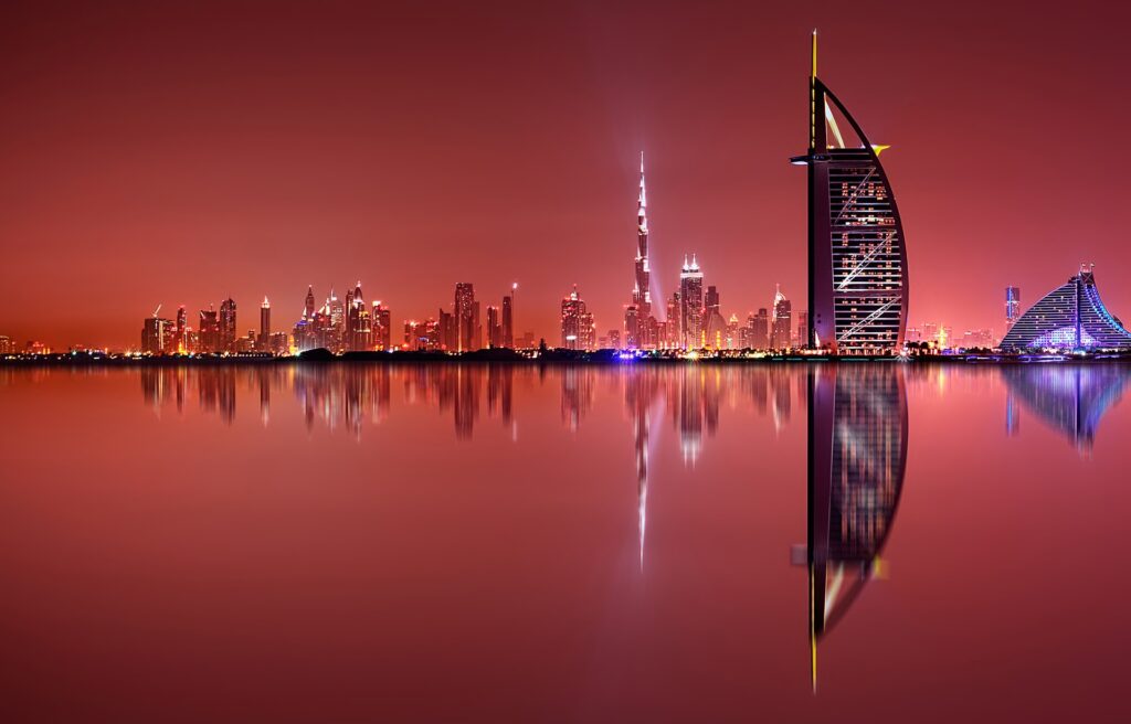 Dubai skyline at night with Burj Al Arab and Burj Khalifa