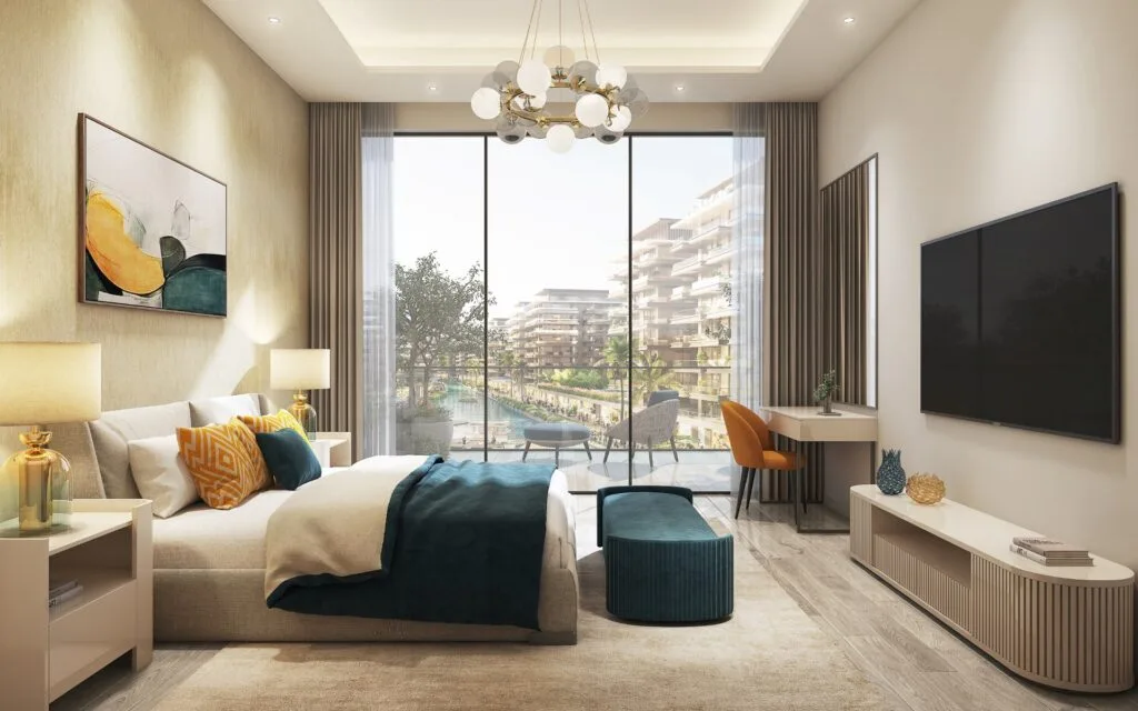 Bedroom interior with large window overlooking waterfront buildings