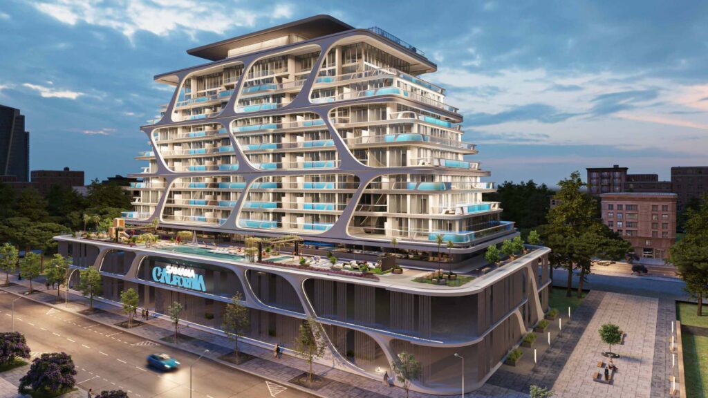 Modern multi-story residential building with balconies and rooftop terrace
