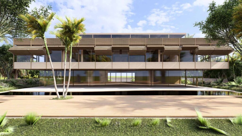 Modern two-story building with large glass windows and surrounding greenery