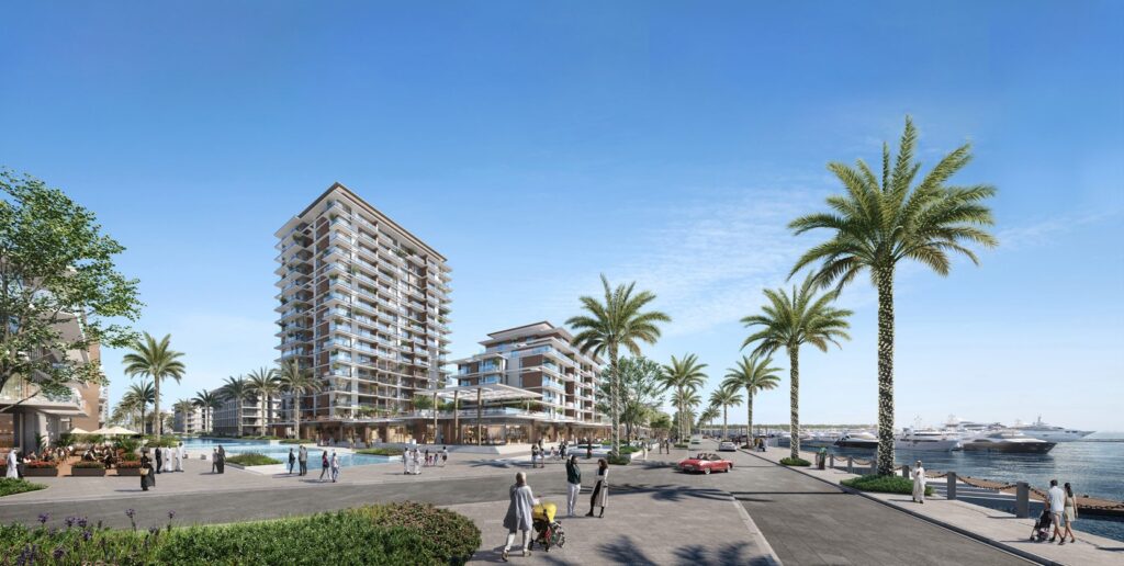 Exterior view of waterfront buildings with palm trees and yachts