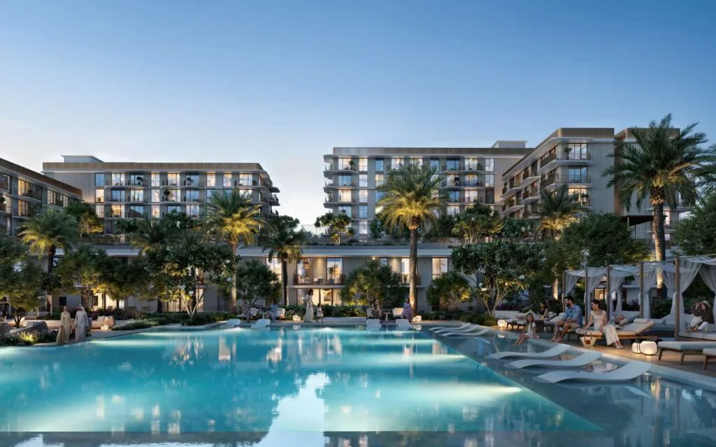 Exterior view of residential buildings with pool and palm trees