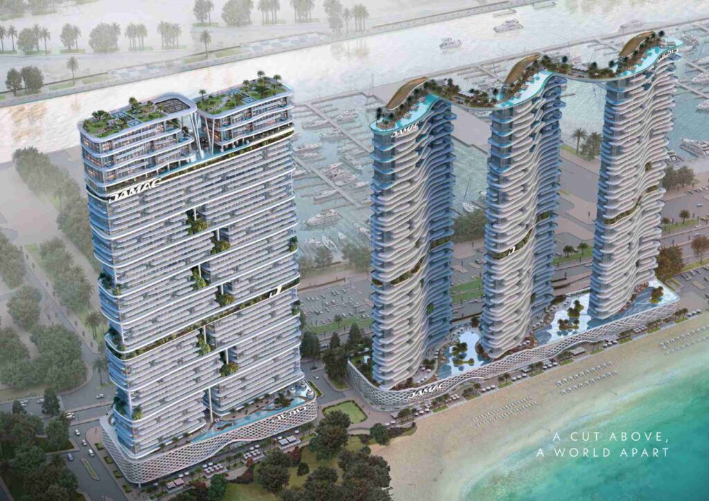 Aerial view of five modern high-rise buildings near waterfront