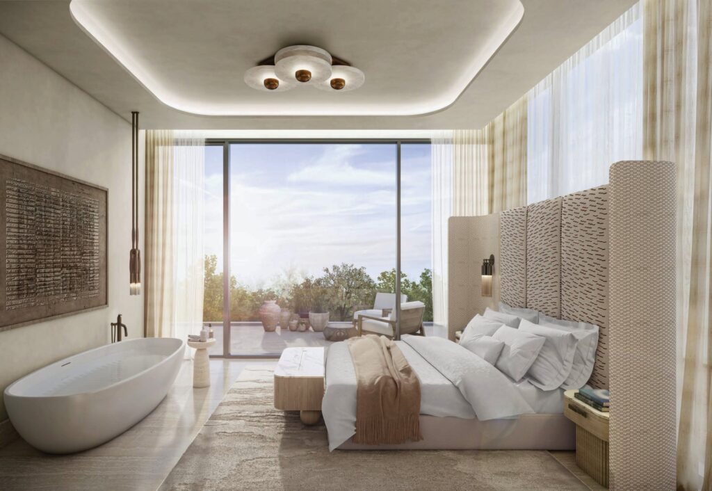 Bedroom interior with large bed and bathtub near window