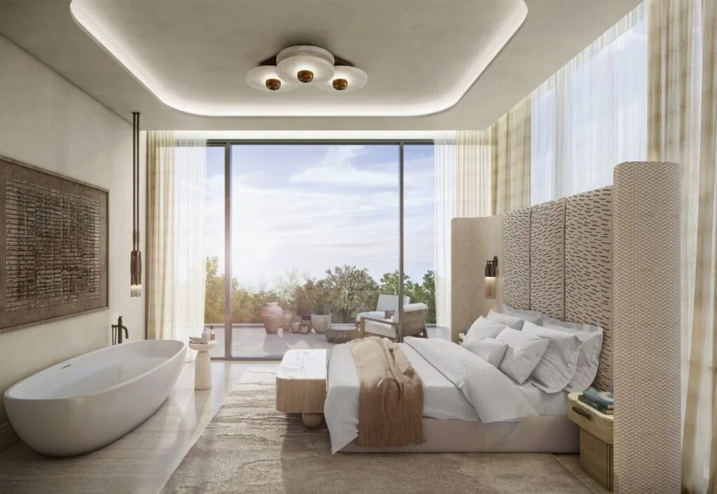 Bedroom interior with large bed and bathtub near window