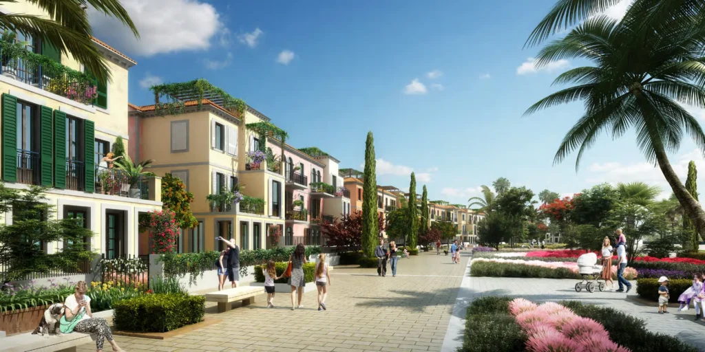 Pedestrian street in Sur La Mer with townhouses, palms and flower beds (developer rendering)
