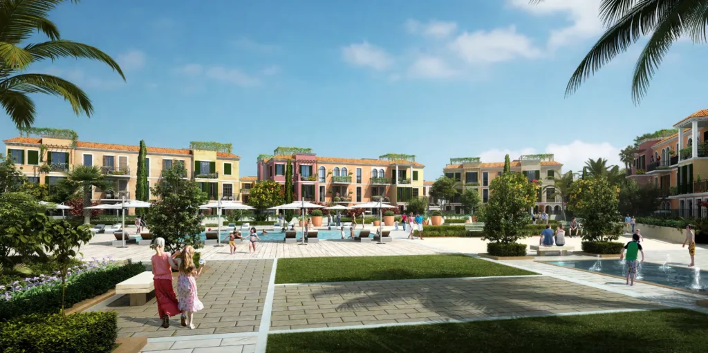 Sur La Mer courtyard garden with pool, loungers and townhouses (developer rendering)